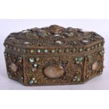 AN 18TH CENTURY TIBTAN BRONZE BUDDHISTIC BOX AND COVER inlaid with hardstones, turquoise and beasts.