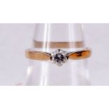 A 9CT GOLD AND DIAMOND RING. 2 grams. M/N.