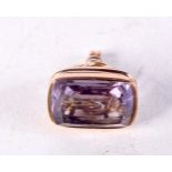 AN ANTIQUE YELLOW METAL AMETHYST FOB SEAL. 3.5 grams. 2 cm x 1.5 cm.