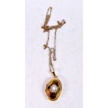 A 9CT GOLD LOCKET. 3.6 grams. 48 cm long, pendant 3 cm x 1.5 cm.