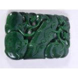 A Carved jade fruiting pod plaque 11 x 7 cm.