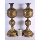 A GOOD LARGE PAIR OF 19TH CENTURY MIDDLE EASTERN BRASS AND BRONZE LAMPS decorated with animals and k