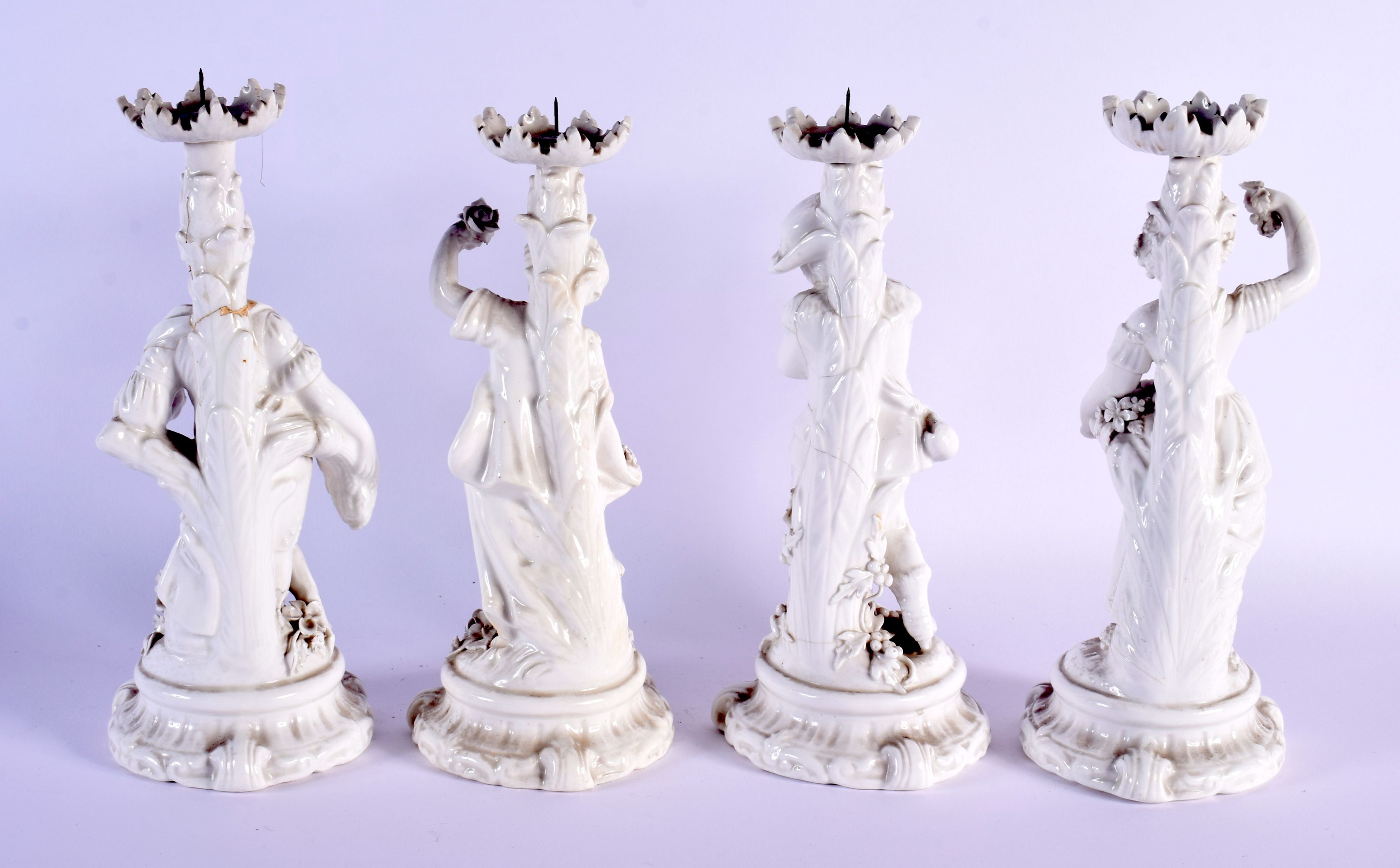 A SET OF FOUR EARLY 20TH CENTURY EUROPEAN BLANC DE CHINE FOUR SEASON CANDLESTICKS. 25 cm high. (4) - Bild 2 aus 3