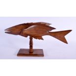 A PITCAIRN ISLANDS CARVED WOOD FLYING FISH by Ivan Christian. 33 cm x 20 cm.