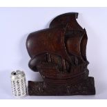 AN ART DECO CARVED TREEN WOOD PLAQUE OF A CONTINENTAL BOAT. 40 cm x 28 cm.