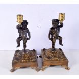 A pair of small bronze Cherub candle sticks mounted on gilded stands bearing DU stamp 22cm (2).