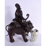 A LARGE 19TH CENTURY JAPANESE MEIJI PERIOD BRONZE OKIMONO modelled as a male upon an elephant. 37 cm