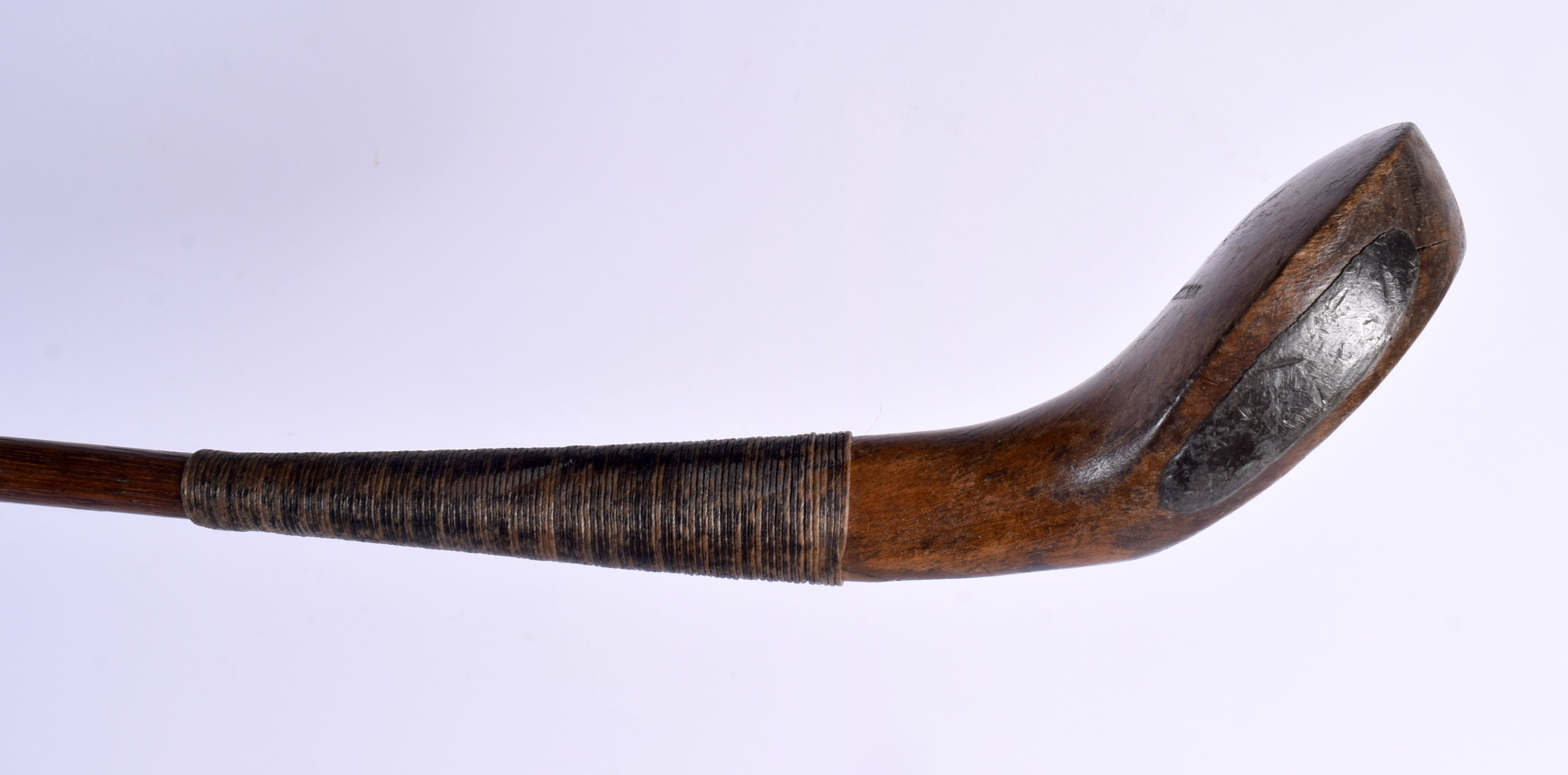 A LATE 19TH CENTURY JAMES HUTCHISON OF NORTH BERWICK GOLF CLUB with scared neck and hickory shaft.