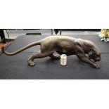 A LARGE CONTEMPORARY BRONZE FIGURE OF A PANTHER modelled in a roaming stance. 100 cm x 30 cm.