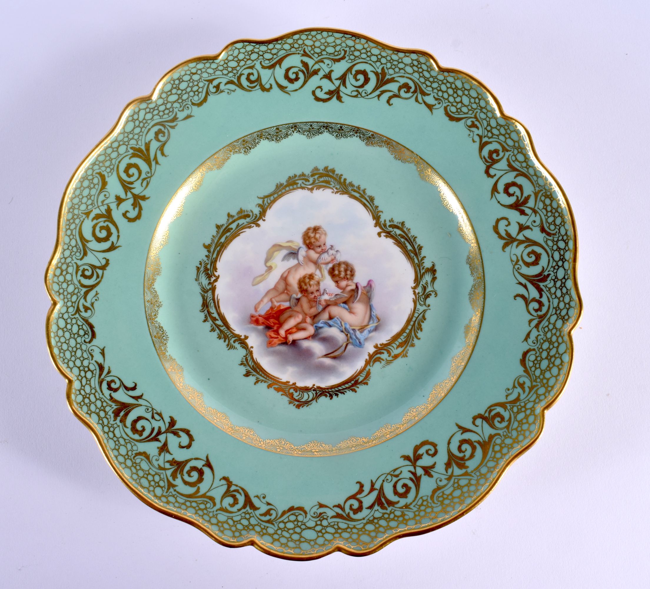 A FINE ANTIQUE MEISSEN PORCELAIN PLATE painted with three putti. 25 cm wide.