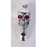 A STERLING SILVER SKULL WHISTLE PENDANT WITH GEM SET EYES. Stamped 925, 5cm x 1.6cm x 1.9cm, weight