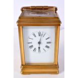 AN ANTIQUE REPEATING CARRIAGE CLOCK. 18 cm high inc handle.