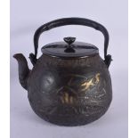 A FINE 18TH/19TH CENTURY JAPANESE MEIJI PERIOD GOLD AND SILVER INLAID IRON TEAPOT decorated with lan