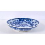 A Chinese porcelain blue and white dish decorated with a dragon 4 x 20cm.