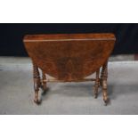 A 19th Century Burr walnut Sutherland table with oval twin flap top and barley twist legs 74 x 106 x