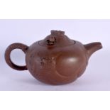 AN EARLY 20TH CENTURY CHINESE YIXING POTTERY TEAPOT AND COVER Late Qing/Republic. 12 cm wide.