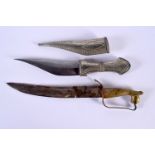 A VINTAGE MIDDLE EASTERN WHITE METAL KNIFE and another horse head knife, both with inscribed blades.