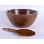 A CHARMING TREEN CARVED WOOD BUTTER PAT with spoon. Bowl 22 cm wide. (2)