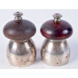 TWO CONTINENTAL SILVER PEPPER MILLS. Stamped Sterling Italy. 6.5cm x 4cm, total weight 155g