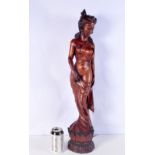 A large carved wood sculpture of a Balinese female 69cm.