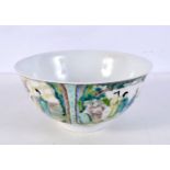 A Chinese porcelain Famille Verte bowl decorated with figures in panels 8 x 15 diameter.