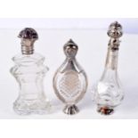 THREE SILVER MOUNTED SCENT BOTTLES. Largest 11.5cm x 3.5cm (3)