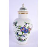 A GERMAN MEISSEN PORCELAIN VASE AND COVER decorated with birds and foliage. 26.5 cm high.