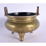 A LATE 19TH CENTURY CHINESE TWIN HANDLED BRONZE CENSER bearing Xuande marks to base. 12 cm wide.