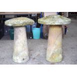 A PAIR OF GARDEN SADDLE STONES. 67 cm x 40 cm.