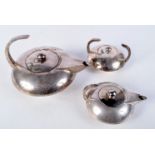 A LARGE ART DECO SILVER PLATED THREE PIECE TEASET. Largest 21 cm wide. (3)