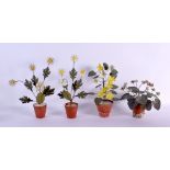 A RARE SET OF FOUR ANTIQUE TOLEWARE TERRACOTTA COUNTRY HOUSE FLOWERS. Largest 32 cm high. (4)
