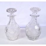 A near pair of 19th Century cut glass decanters 26 cm (2).