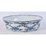A Chinese porcelain blue and white petal shape bowl decorated with a dragon 5 x 19 cm.