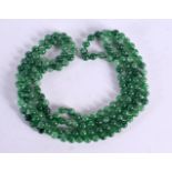 A CHINESE JADE NECKLACE 20th Century 98 grams. 136 cm long.