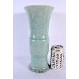 AN EARLY CHINESE PALE CELADON GLAZED GU FORM VASE Song/Yuan. 30 cm high.