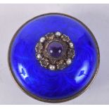 A SILVER GILT AND BLUE ENAMEL BOX AND COVER WITH GEMS MOUNTED TO COVER. 7.2cm x 5.1cm, weight 119.2