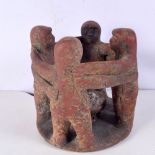 A red sandstone four figure burner stand . 18 x 19 cm.