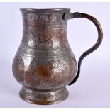 A RARE 16TH/17TH CENTURY ISLAMIC MIDDLE EASTERN TANKARD decorated with figures in various pursuits.