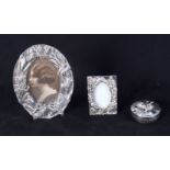 A small Silver plate picture frame together with a smaller frame and a lidded pot 12.5 cm (3).