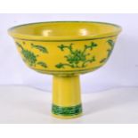 A Chinese porcelain Imperial yellow stem cup decorated in relief with foliage 14 x 18 cm.