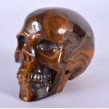 A CHINESE CARVED TIGERS EYE SKULL 20th Century. 8 cm x 6 cm.