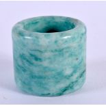A CHINESE CARVED JADE ARCHERS RING 20th Century. 2.25 cm wide.
