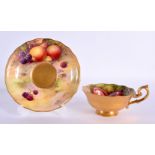 Royal Worcester fruit painted cup and saucer painted with fruit on a mossy bank, by Hale and Moseley