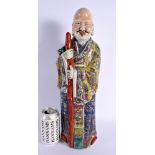 A LARGE CHINESE REPUBLICAN PERIOD FAMILLE ROSE FIGURE embellished in floral robes. 45 cm high.