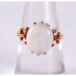 A 14CT GOLD AND OPAL RING. 2.5 grams. L.