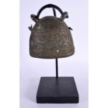 A MIDDLE EASTERN BRONZE BELL. 24 cm high.