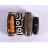 FOUR CHINESE TIBETAN AGATE BEADS 20th Century. (4)