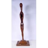 A large carved wood sculpture of a figure signed J D Smyth 73 cm.