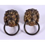 A PAIR OF GEORGE III LION MASK HEADS. 2.5 cm wide.