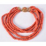 AN 18CT GOLD AND CORAL NECKLACE. 312 grams. 43 cm long.